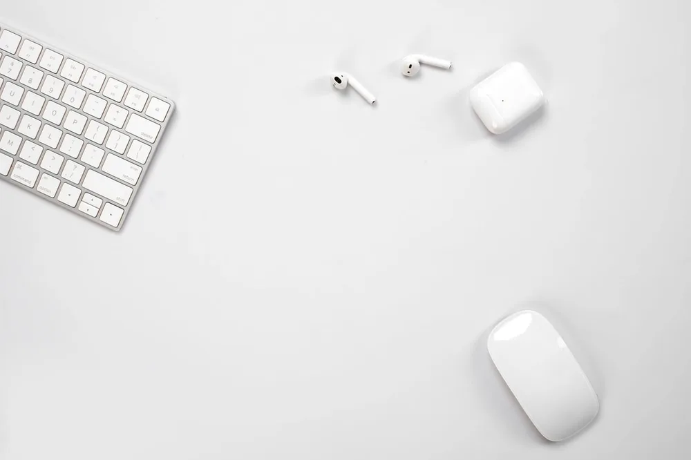 A wireless keyboard and mouse on a clean cable-free desk